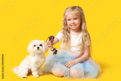 Cute little girl with toy a...