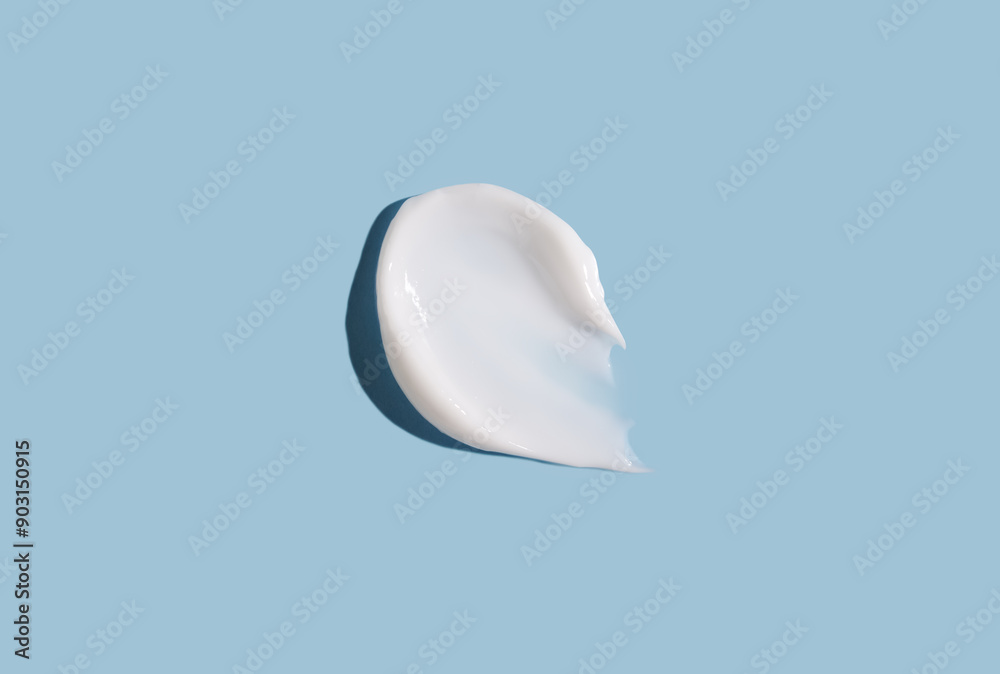Cosmetic smear of cream texture on a blue background. Skin care. Cosmetic smear of cream texture on a blue background. Skin care.