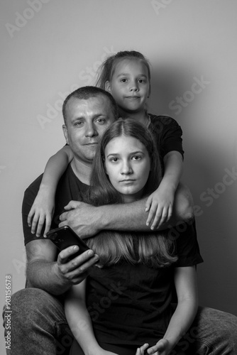 Father with daughters. Black and white photo