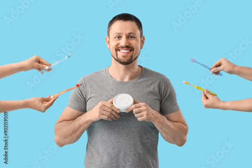 Young man with tooth powder...
