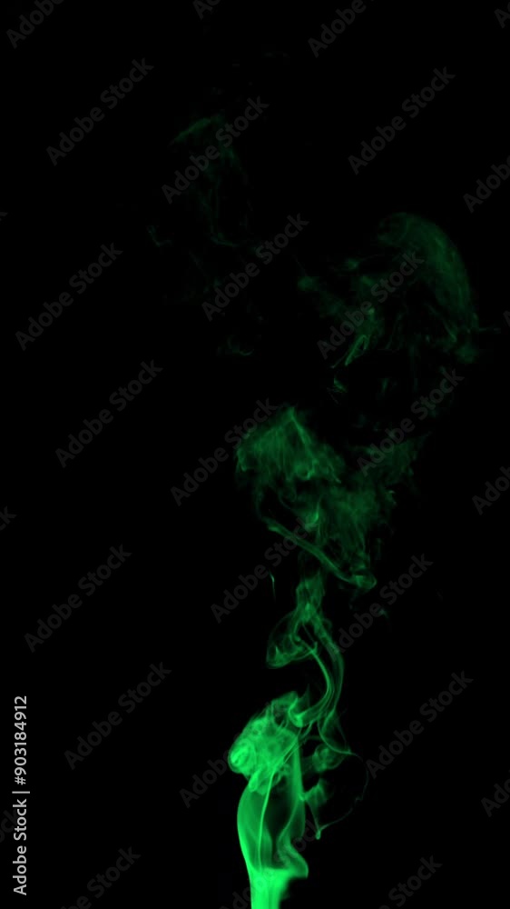 Real green smoke from incense on black background, smoke overlay in slow motion. Close up. Real green smoke from incense on black background, smoke overlay in slow motion. Close up.
