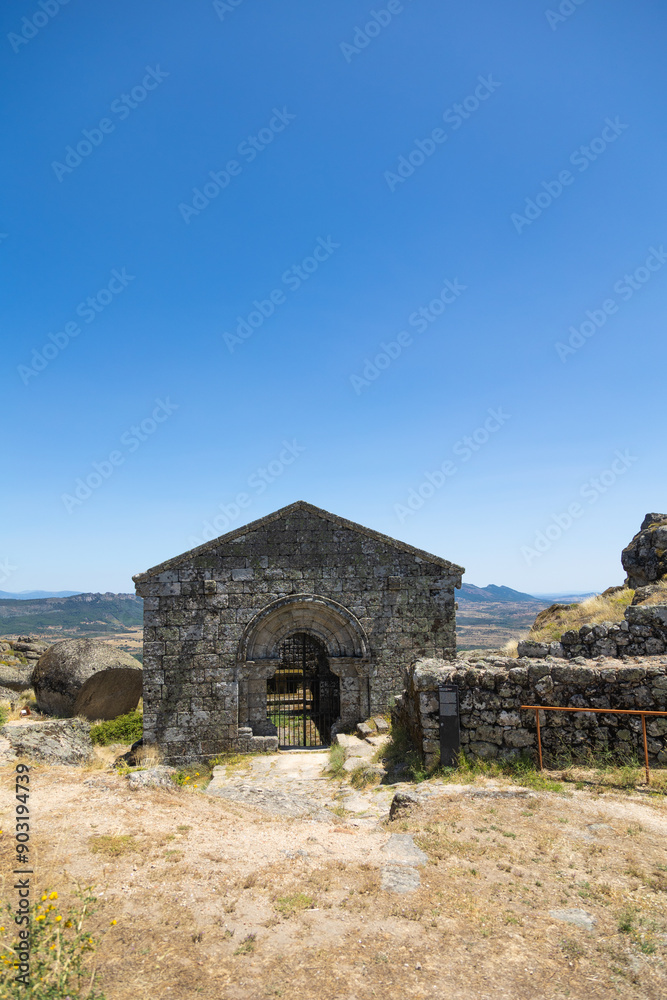 The Chapel of São Miguel in Monsanto, Portugal, is a stunning example of medieval stone architecture. This ancient site sits atop a hill, offering breathtaking panoramic views and a glimpse The Chapel of São Miguel in Monsanto, Portugal, is a stunning example of medieval stone architecture. This ancient site sits atop a hill, offering breathtaking panoramic views and a glimpse