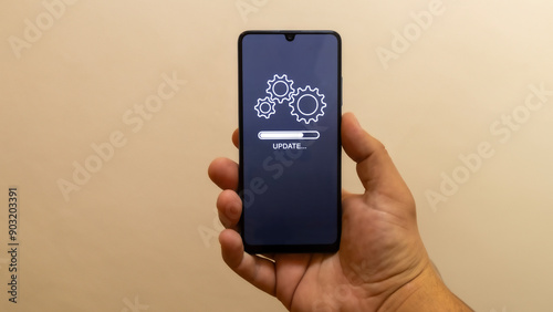 “Update” message on smartphone screen. Smart device update, software upgrade theme. Personal phone maintenance.