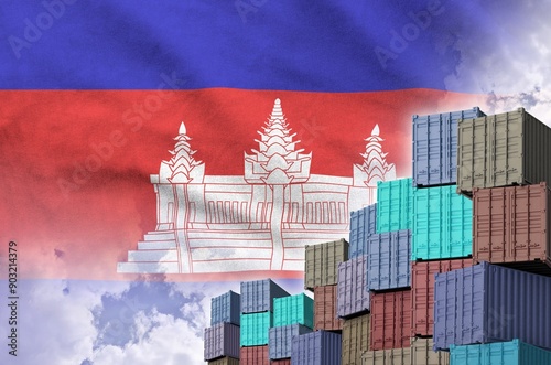 Cambodia flag and big stack of shipping cargo containers in docks with sky background close up photo