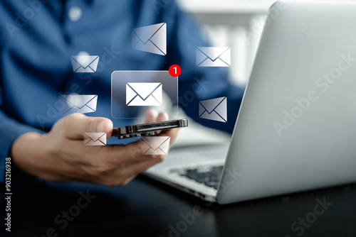 Businessman using smartphones check New email notifications and business digital online marketing. Inbox receiving electronic message alert. icon envelope virtual screen, communication technology.
