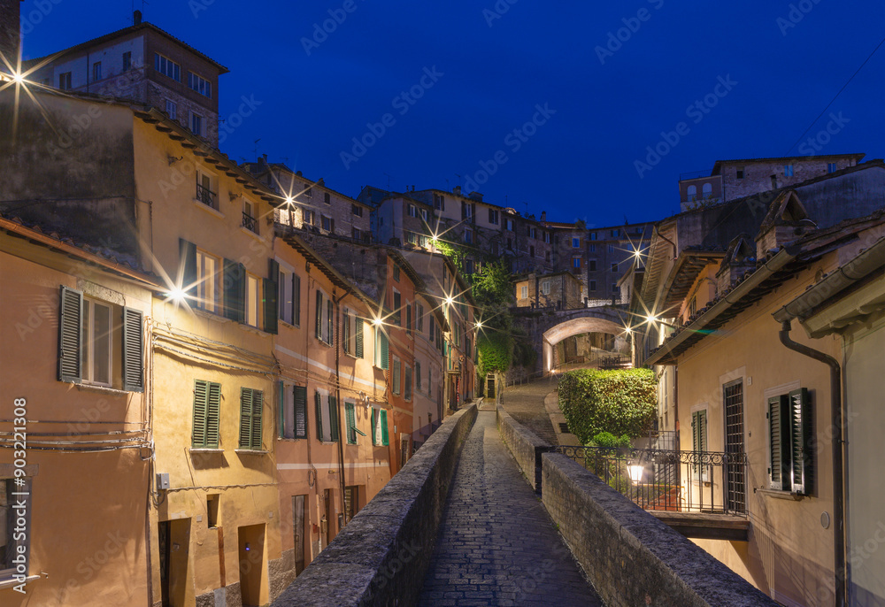 Perugia - The aqueduct and old town at dusk. Perugia - The aqueduct and old town at dusk.