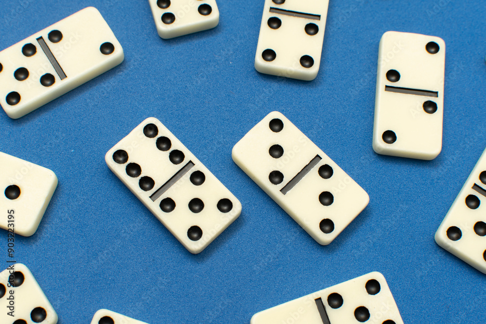 Dominoes bones on blue background Dominoes bones on blue background