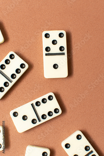 Dominoes bones on brown background 