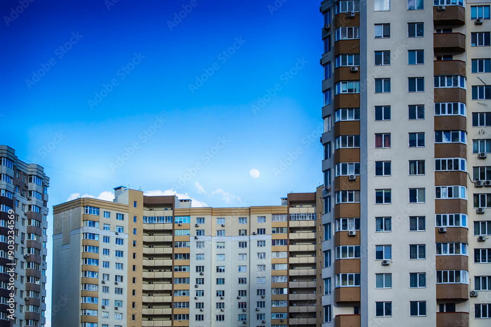 Fototapeta premium Winter moon over building