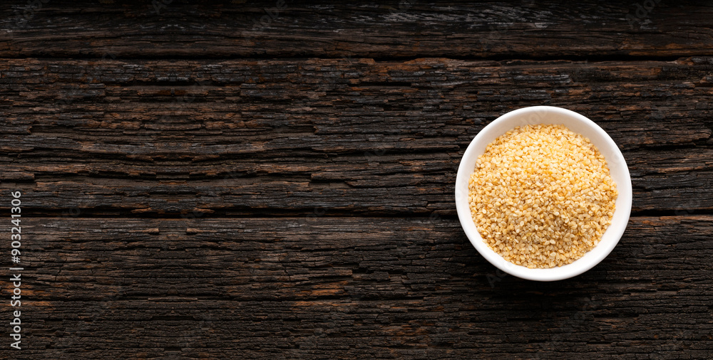 Organic dried sesame seeds in the bowl - Sesamum indicum Organic dried sesame seeds in the bowl - Sesamum indicum
