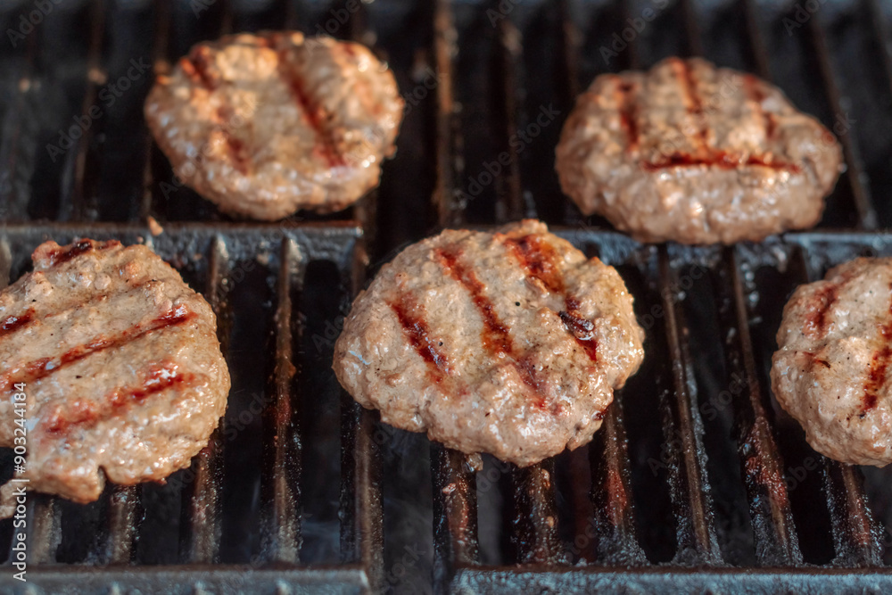 Selective focus background image of burgers grillin summer activitie Selective focus background image of burgers grillin summer activitie