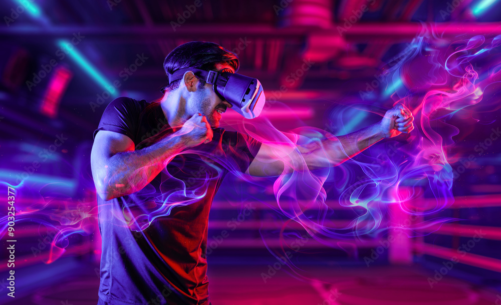 Man wearing VR glass and smashing or punching at camera in neon boxing arena. Sport gamer boxing and moving gesture in metaverse or virtual world while using digital technology innovation. Deviation. Man wearing VR glass and smashing or punching at camera in neon boxing arena. Sport gamer boxing and moving gesture in metaverse or virtual world while using digital technology innovation. Deviation.