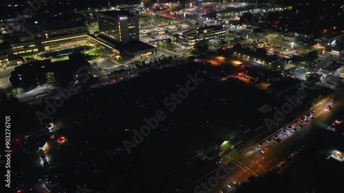 Hot air balloon burner show with crowd - high, drone shot
