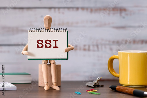 There is notebook with the word SSI. It is an abbreviation for Self Sovereign Identity as eye-catching image. photo