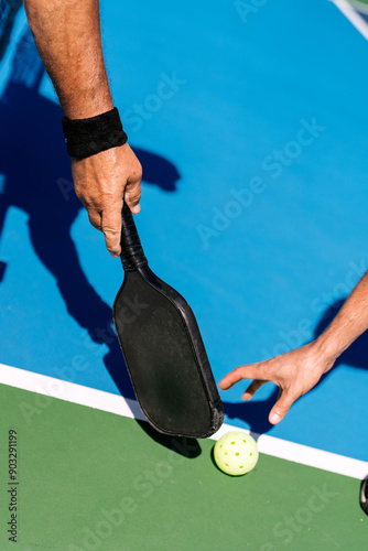 closeup of handle playing pickleball