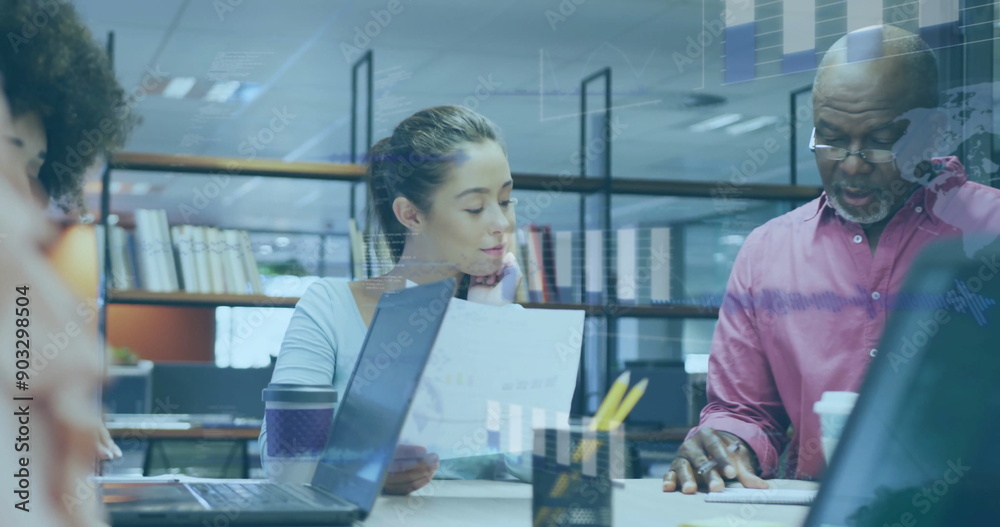 Image of financial data processing over diverse business people in office Image of financial data processing over diverse business people in office