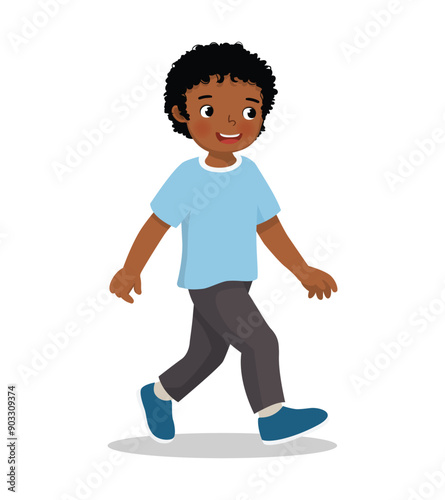cute little African boy walking on the street
