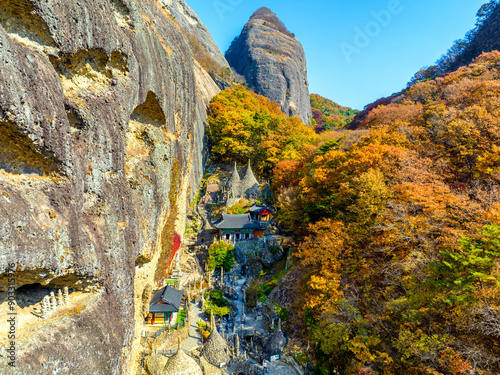 Dongchon-ri, Jinan-gun, Jeollabuk-do, South Korea - November 1, 2022: High angle and autumnal view of Daeungjeon Hall of Tabsa Temple with cliff and peak of Maisan Mountain
 photo