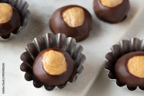 Smooth and Creamy Buckeye Chocolate and Peanut Butter Candies / Chocolates on White Background