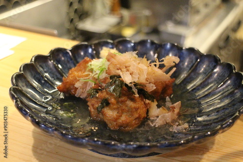 Japanese cuisine : Chicken karaage (Deep fried chicken) with dashi sauce in Kyoto, Japan photo