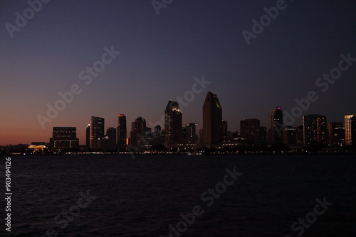 san diego city skyline at sunset from coronado island california photo