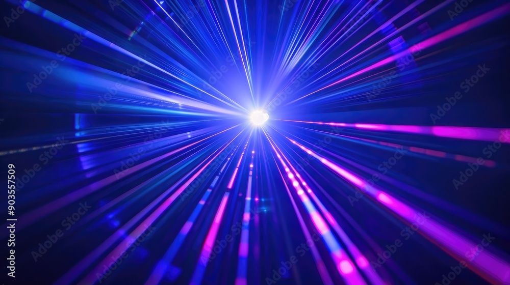 Obraz premium Bright laser light beams in blue and violet on a dark backdrop