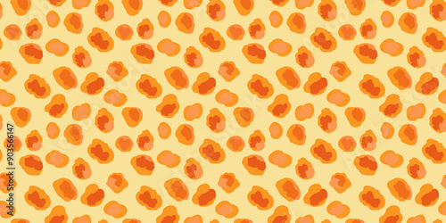 A background of orange blobby shape on a yellow background