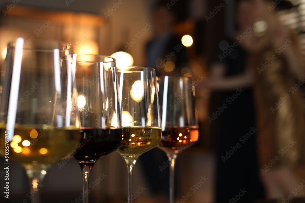Different tasty wines in glasses indoors, selective focus Different tasty wines in glasses indoors, selective focus