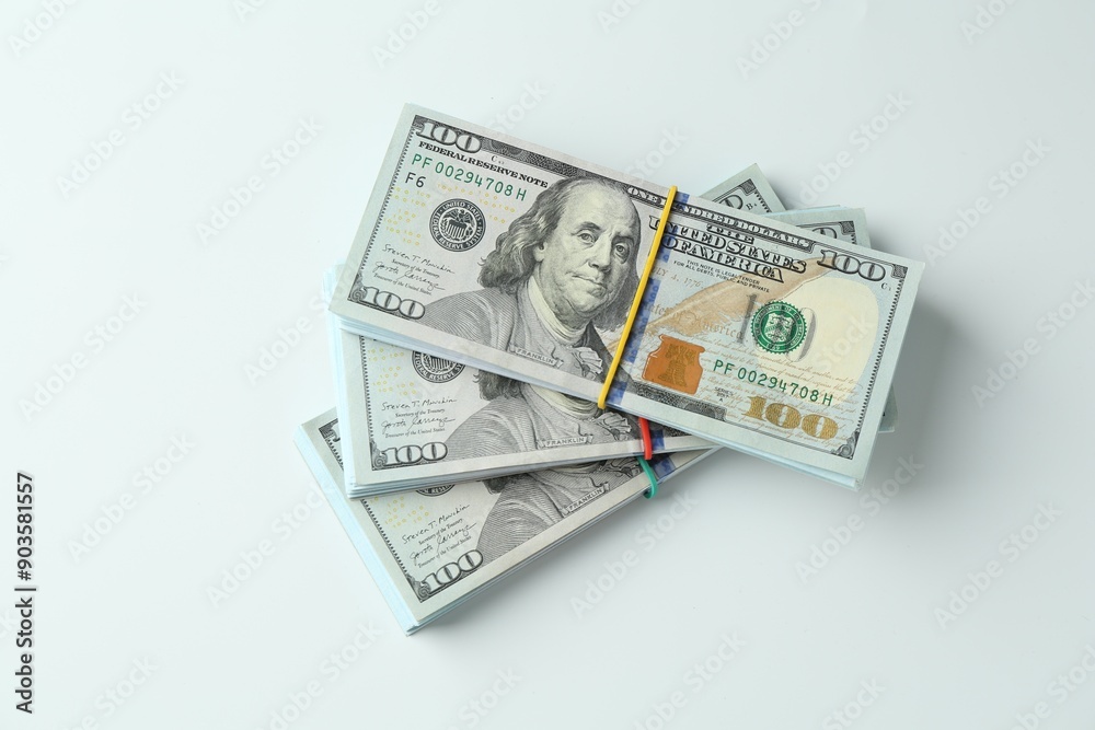 Bundles of dollar banknotes on white background, top view Bundles of dollar banknotes on white background, top view