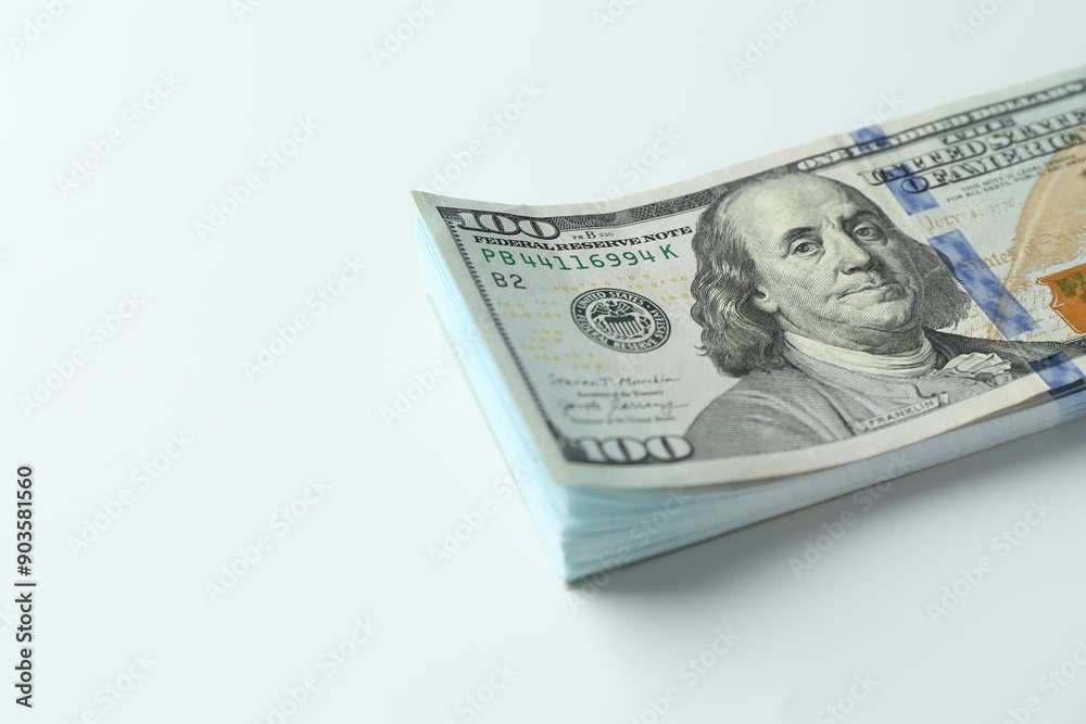 Stack of dollar banknotes on white background, closeup. Space for text Stack of dollar banknotes on white background, closeup. Space for text