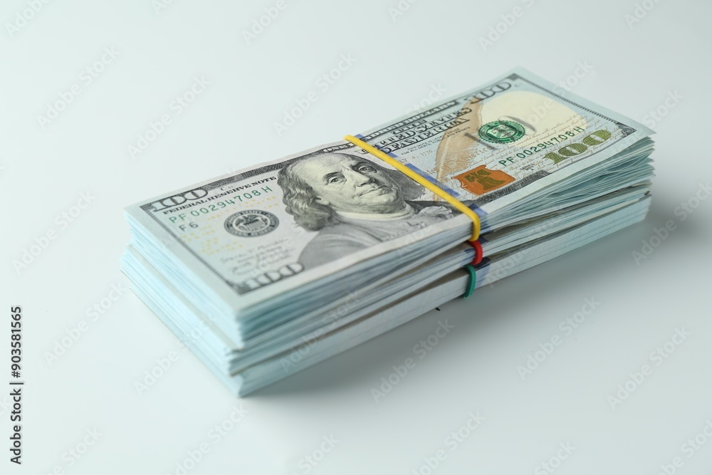 Bundles of dollar banknotes on white background, closeup Bundles of dollar banknotes on white background, closeup