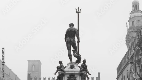 The fountain of Neptune during a rainy day in Bologna, Italy. photo