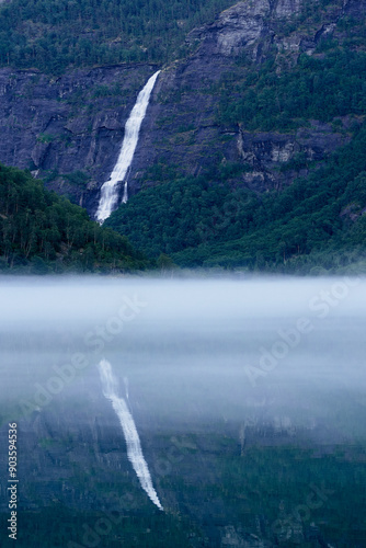 The Aasafossen Waterfall reflected in the Eidsvatnet Lake, Skjolden, Norway. photo