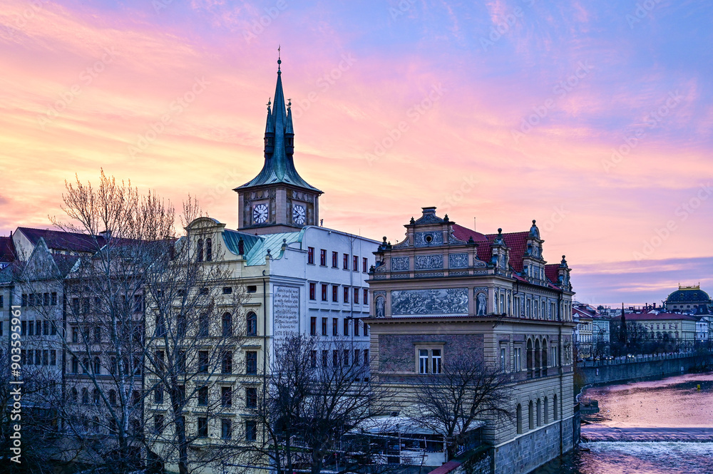 Fototapeta premium Prague at sunrise over the famous Charles Bridge with a panoramic view of the Bedrich Smetana Museum in the early morning with a beautiful sky, Prague, Czech Republic