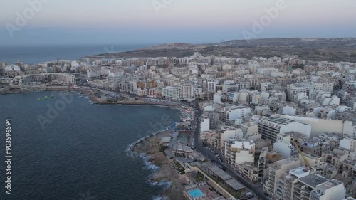 Seaside Cityscape Of Saint Paul's Bay On The Northeast Coast of Malta. Aerial Drone Shot photo