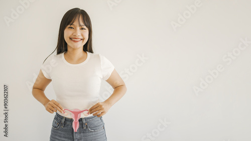 Asian woman hands holding uterus, female reproductive system , woman health, PCOS, gynecologic and cervix cancer concept