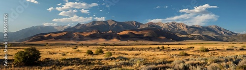 Mountainous Landscape with Golden Grass and Blue Sky - Realistic Image