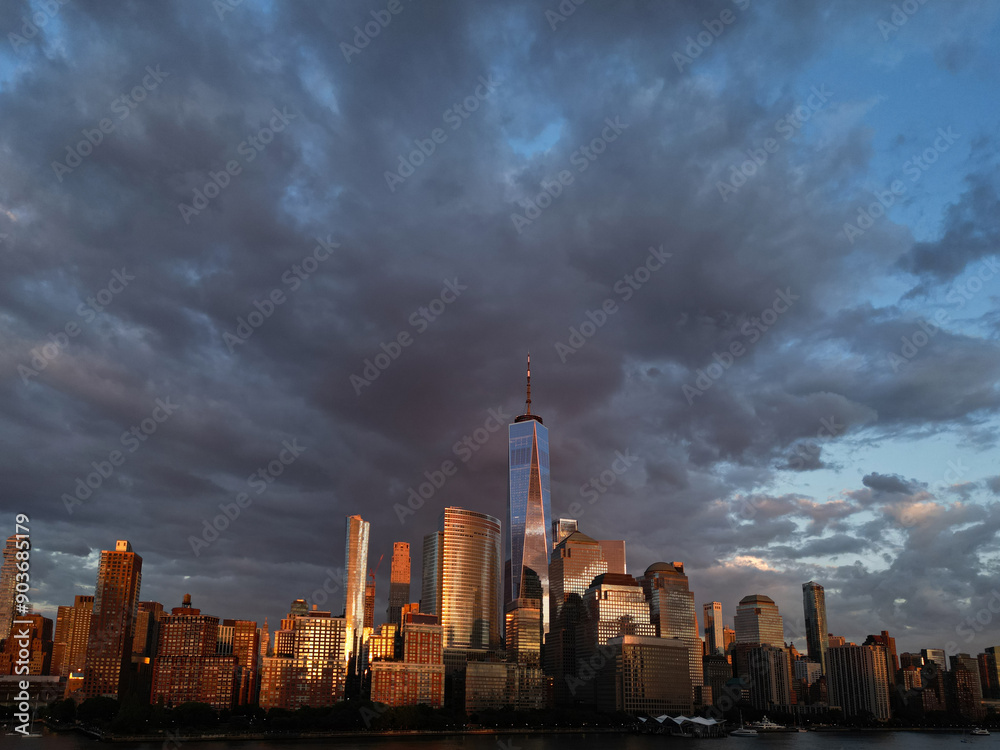 NYC, New York City Skyline with dramatic sky. American Urban Skyscrapers USA near dramatic clouds. New York City skyline, cityscape of Manhattan in New York. Panoramic view on Manhattan. USA. NYC, New York City Skyline with dramatic sky. American Urban Skyscrapers USA near dramatic clouds. New York City skyline, cityscape of Manhattan in New York. Panoramic view on Manhattan. USA.