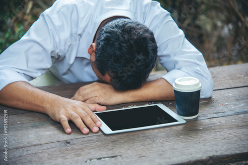 Failure businessman stress bankruptcy man sitting wood desk feeling nagative depression have headache. Men unemployed jobless recession crisis stress lost job. Despair Failure businesspeople concept