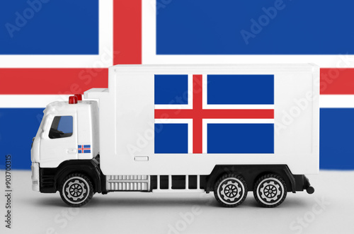 Iceland flag depicted on side wall of white delivery van close up. Shipping and local delivery concept photo