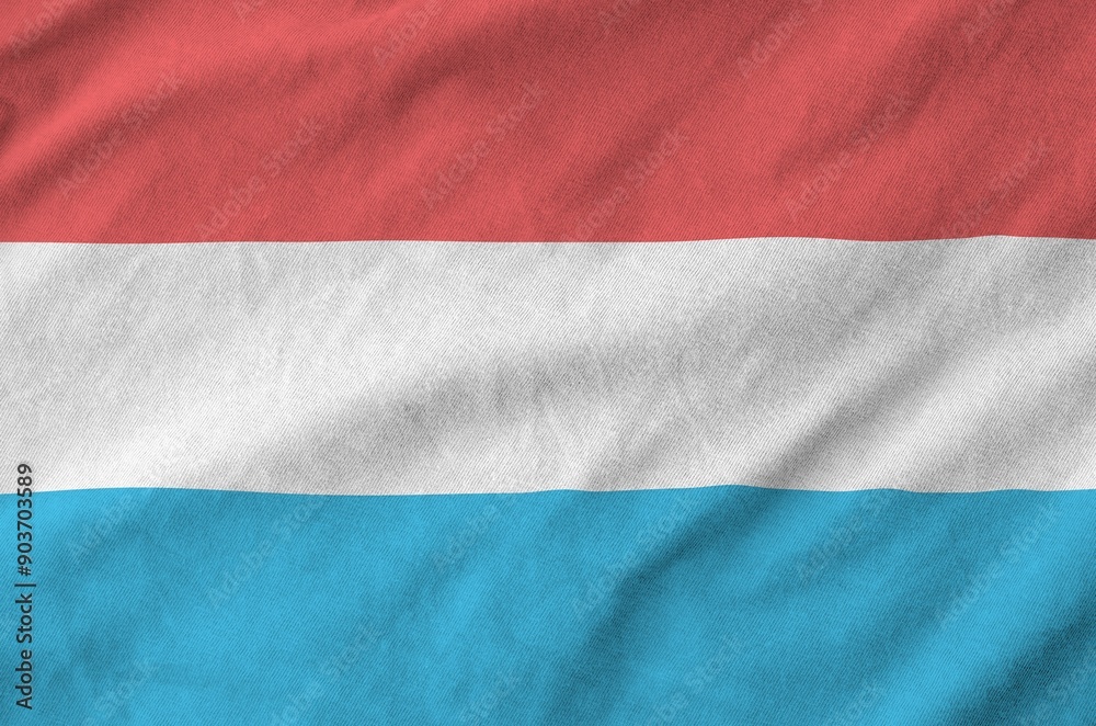 Luxembourg flag depicted on folded wavy fabric of old cloth close up Luxembourg flag depicted on folded wavy fabric of old cloth close up