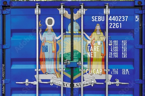 New York US state flag depicted on metal doors of shipping cargo container outdoors in docks area close up photo