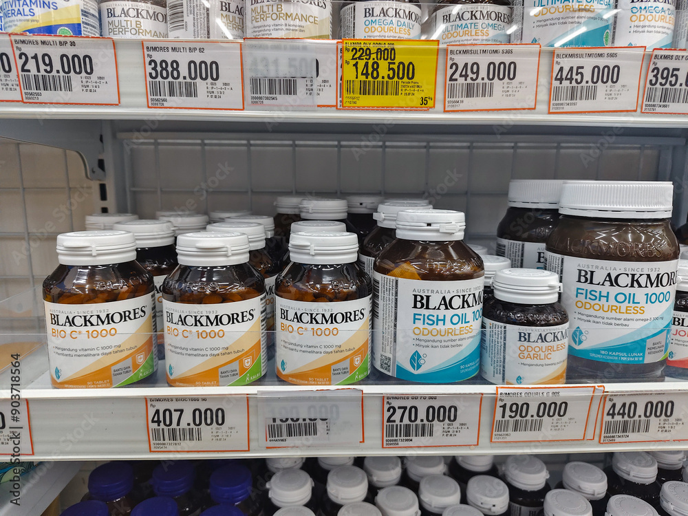several brands and types of vitamin C supplements in stores. Bontang