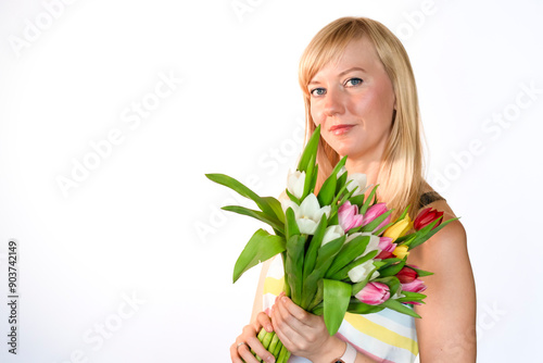 A Woman Holding a Beautiful Bouquet of Colorful Tulips Against a Bright White Background