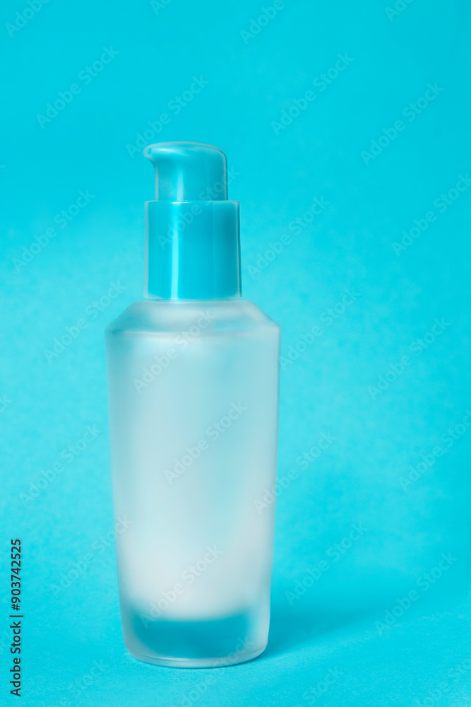 Pump bottle on blue background Pump bottle on blue background