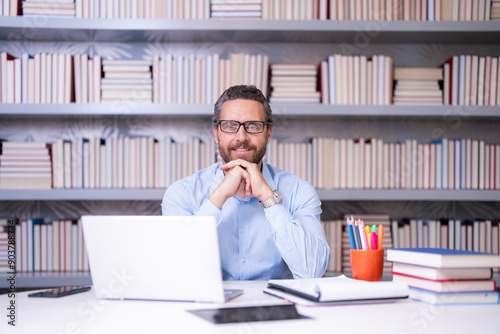 Teachers day. Teacher in school classroom. Knowledge and education with middle aged teacher. Millennial teacher with book. Man teaching lesson in class. Teachers from university exam. College teacher.