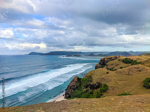 Merese Hill in Lombok is a hill famous for its beauty for a long time, and is even popular among visitors from abroad, beach and hill, view of the sea from the Hill, danger cliff edge, dog on the hill photo