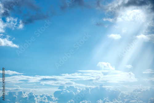 a view of the undercast with clouds through which the rays of the sun are streaming photo