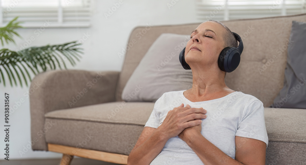 Elderly Woman Relaxing and Enjoying Music with Headphones in a Cozy Home Environment Elderly Woman Relaxing and Enjoying Music with Headphones in a Cozy Home Environment