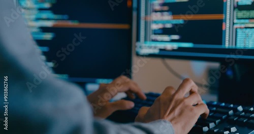 Closeup young adult Asia male freelance typing write prompt AI bot IT app smart program nomad, video game, terminal with coding language, designer, big data center on desktop computer in night office.